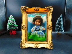 mini doll in frame green